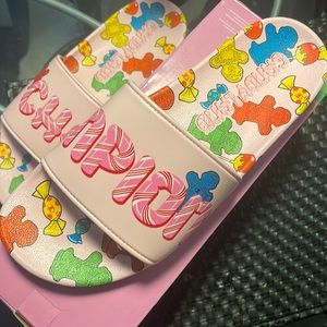 Candyland champion slides. Size 11 fits size 10-11. Brand new never worn
